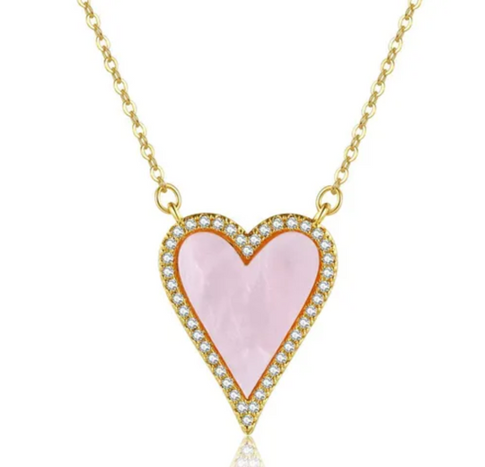 gold necklace with pink heart charm