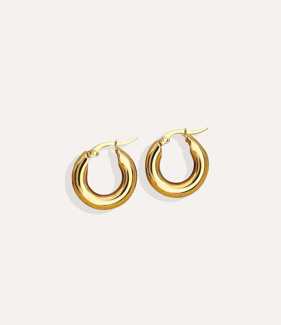 Product shot of the Anna Hoop Earrings in 14k gold plating displaying the rust resistant finish and smooth hoop shape on a white background.