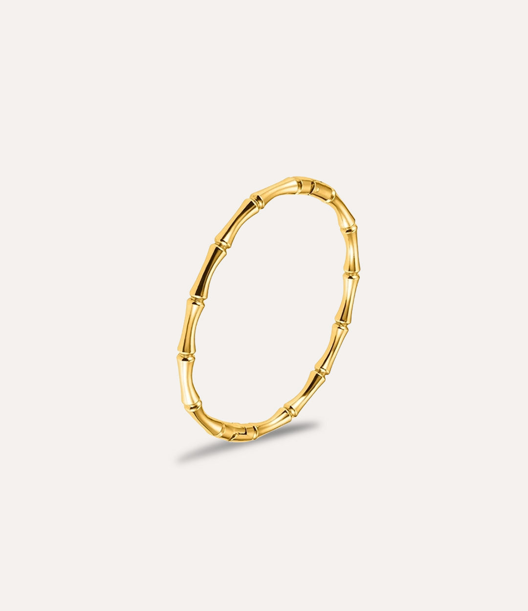 Gold Bamboo Bangle Bracelet made of stainless steel displayed on a neutral background.