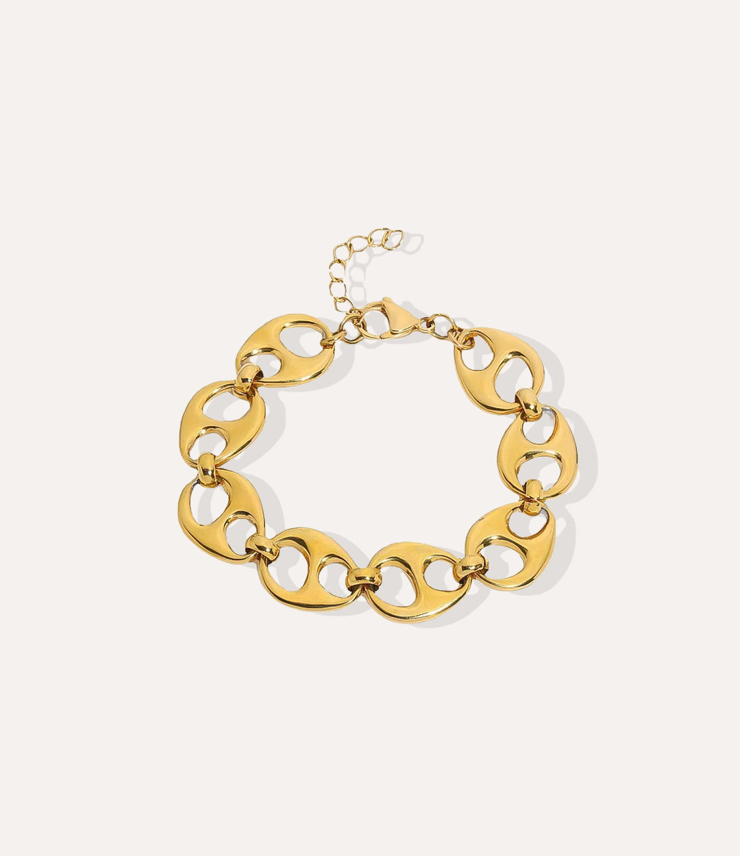 Bella Bottle Cap Link bracelet in gold, featuring chunky links and a bottle-cap style charm in a detailed product shot