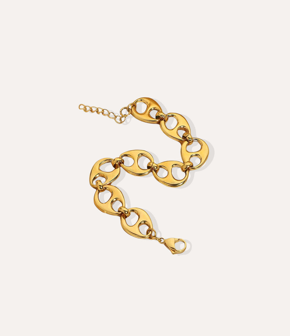 Bella Bottle Cap Link bracelet in gold, featuring chunky links and a bottle-cap style charm in a detailed product shot.