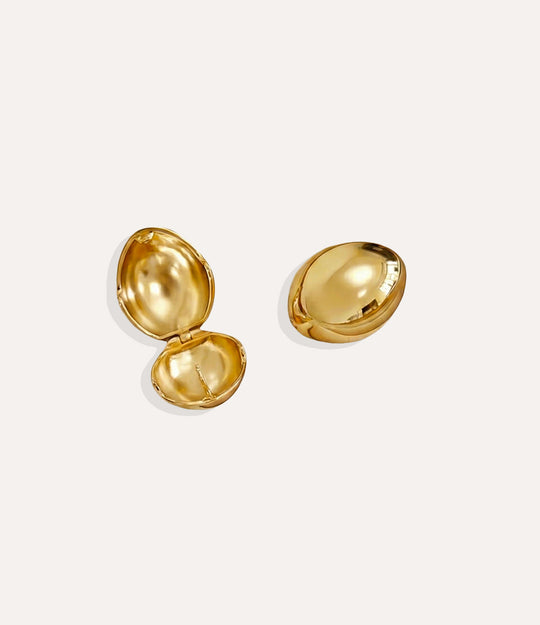 Product shot of the Bianca Earrings in a gold finish displaying the sculptural design and smooth copper based construction on a white background.