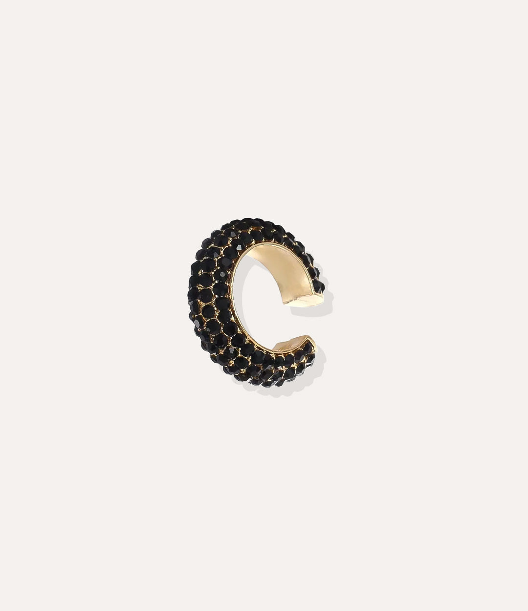 Close up of the Bling Ear Cuff in gold highlighting the vibrant black diamonds and sleek finish.