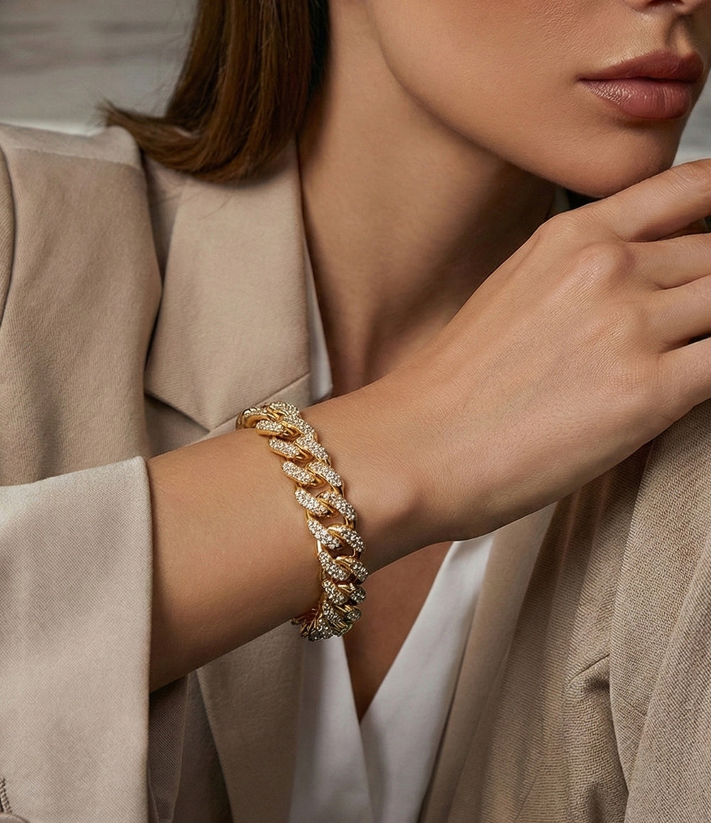 Model wearing the Blinged Out Link Bracelet in gold, showcasing its sparkling link design.