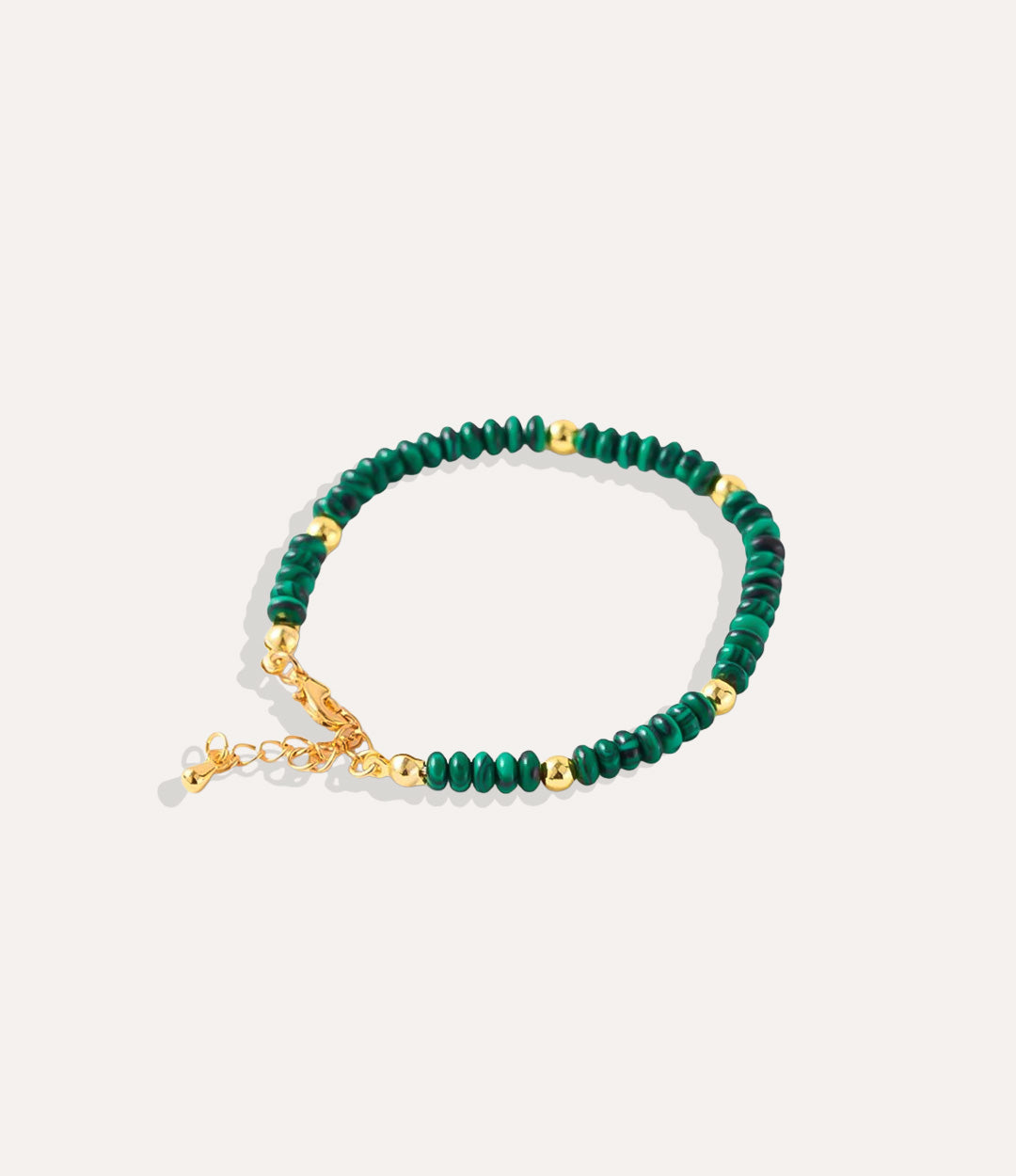 Boho Beaded Bracelet made with natural green marble stones, crystals, and 18k gold-plated brass displayed on a neutral background