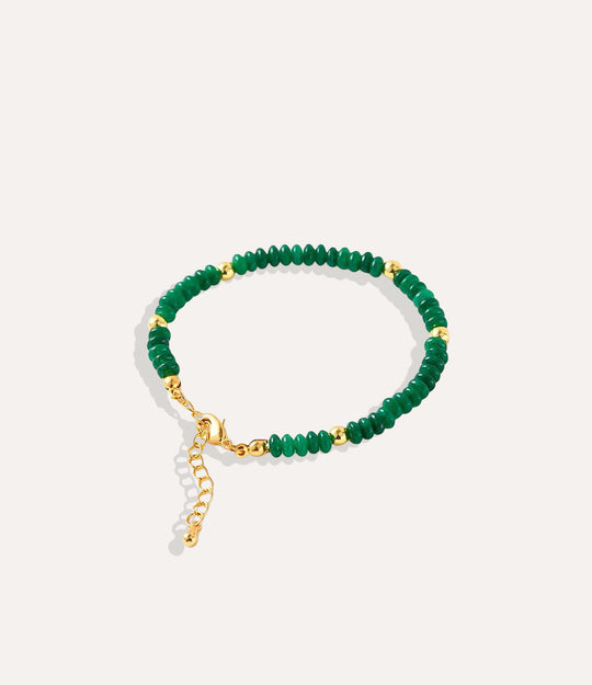 Boho Beaded Bracelet made with natural jade stones, crystals, and 18k gold-plated brass displayed on a neutral background
