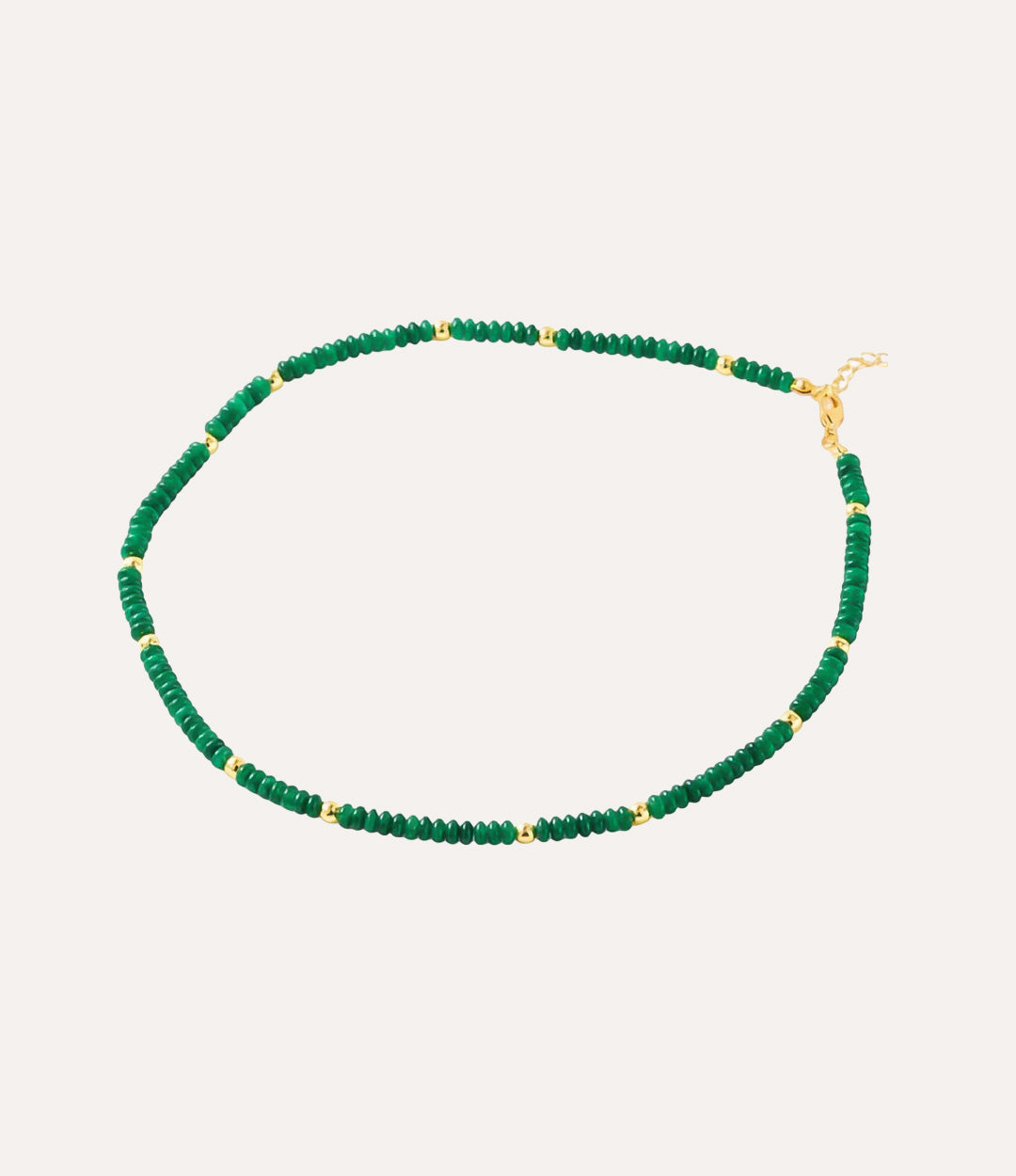 Green beaded necklace with gold accents.
