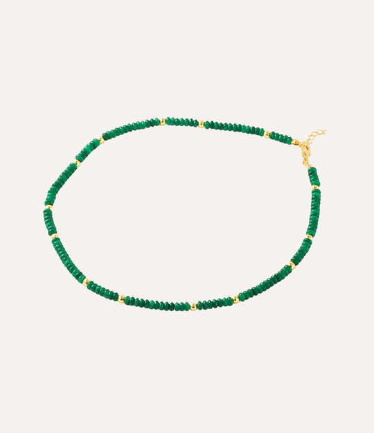 Green beaded necklace with gold accents.