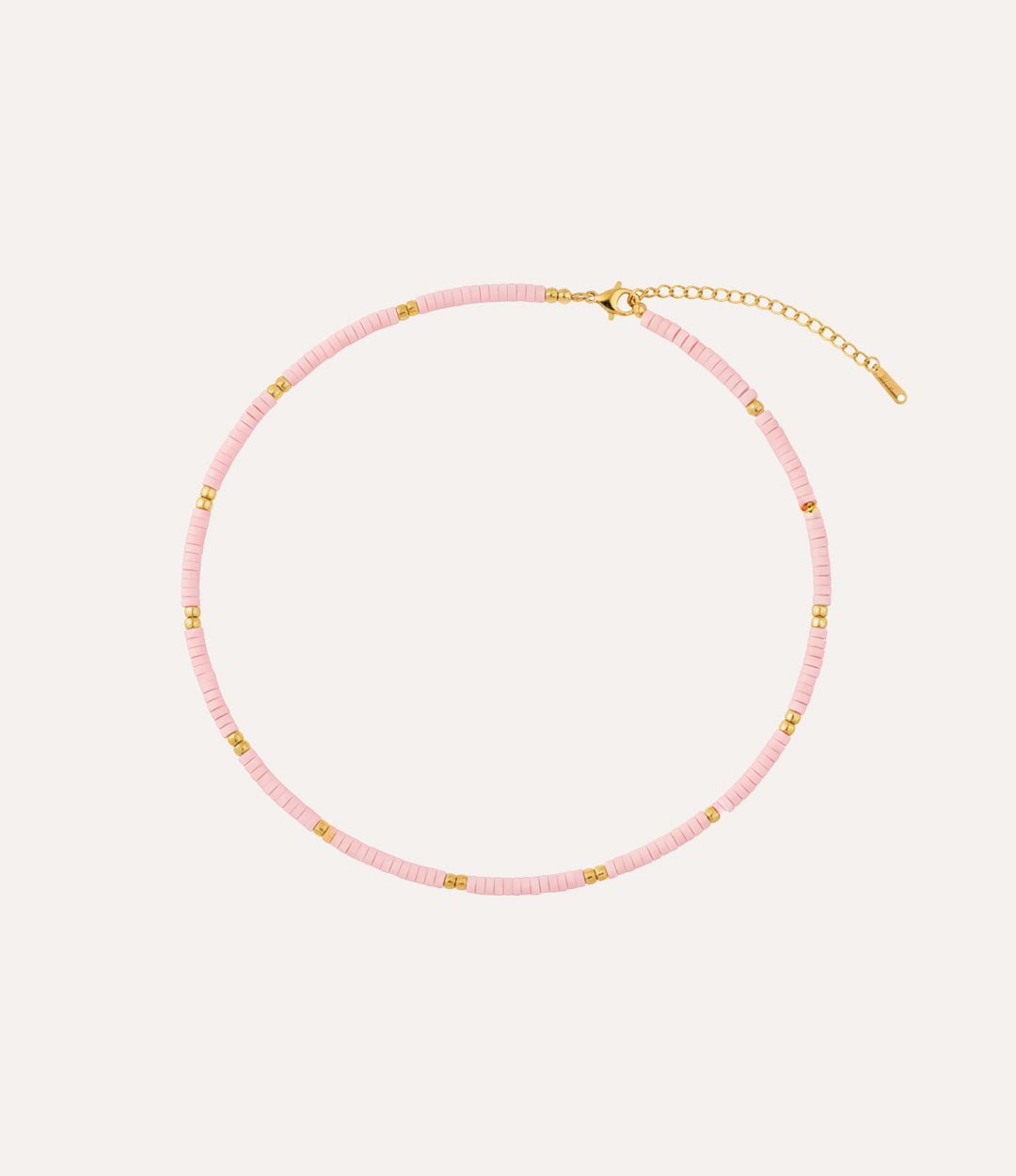 Pink beaded necklace with gold accents. A perfect gift for teens or boho lovers.