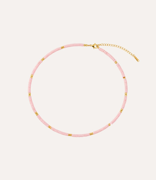Pink beaded necklace with gold accents. A perfect gift for teens or boho lovers.
