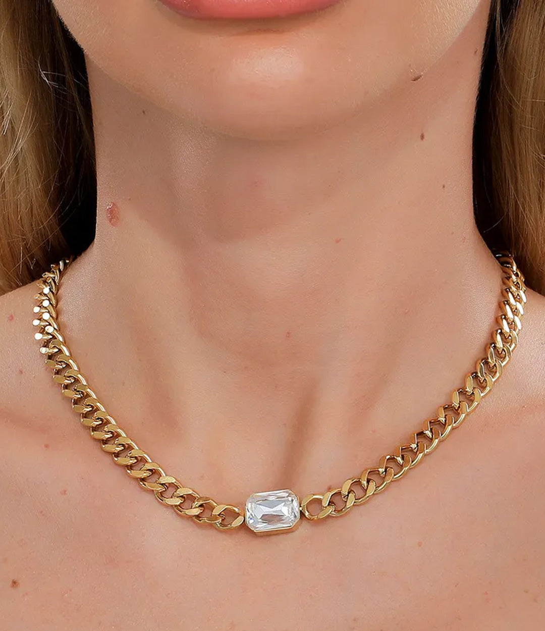 Close-up of the Chunky Solitaire Chain showcasing gold-plated links and center pendant