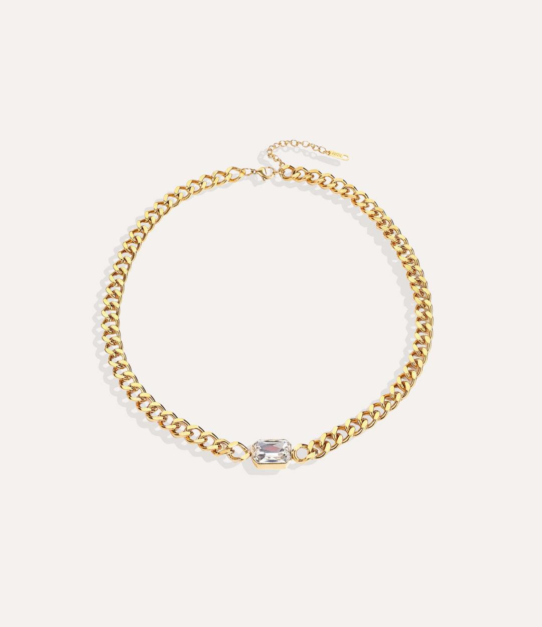 Chunky gold solitaire chain necklace with vintage-inspired white pendant on white background