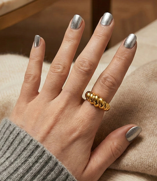 Model wearing gold croissant shaped ring