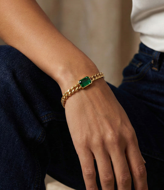 Model wearing the Dainty Solitaire Green Chain bracelet styled alone.