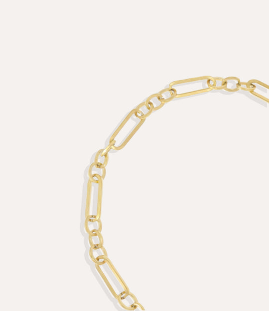 Close-up of the Daisy Chain Necklace showing its polished gold chain links