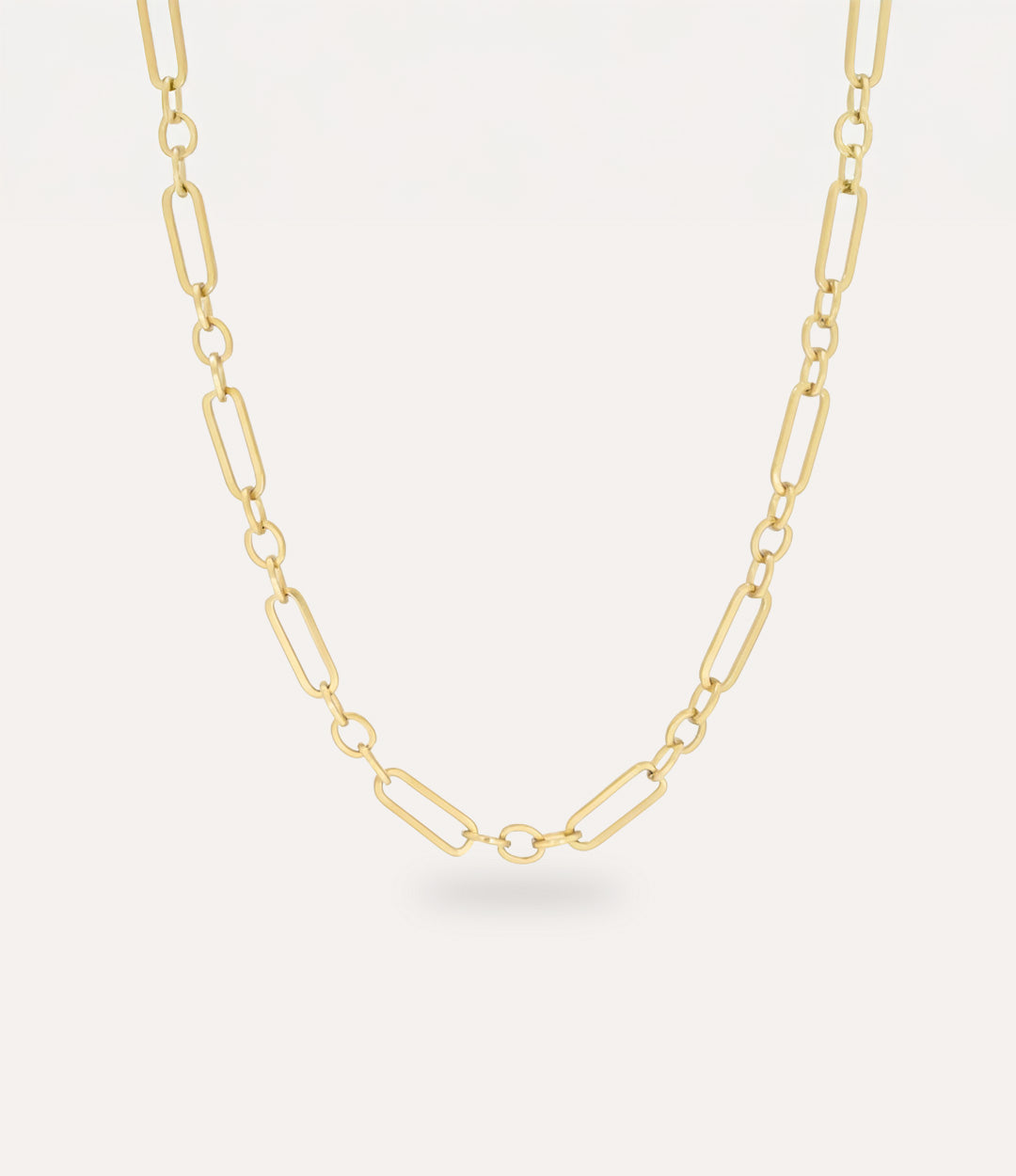 Daisy Chain Necklace in 14k gold plating displayed on a neutral background