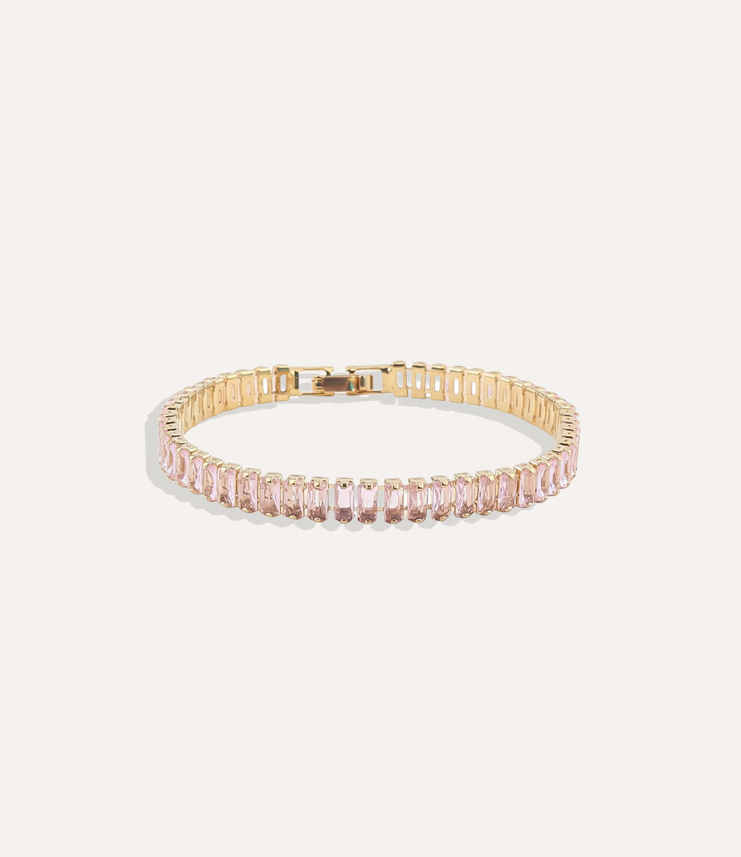 Dazzle Tennis Bracelet with pink sparkling stones in a sleek design displayed on a neutral background.
