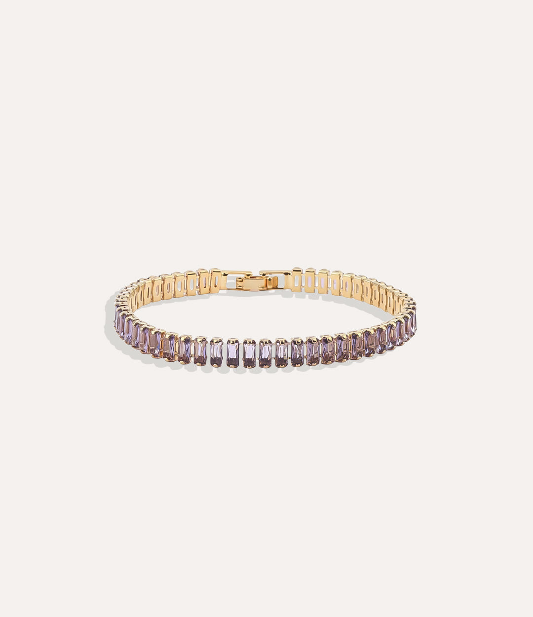 Dazzle Tennis Bracelet with purple sparkling stones in a sleek design displayed on a neutral background.