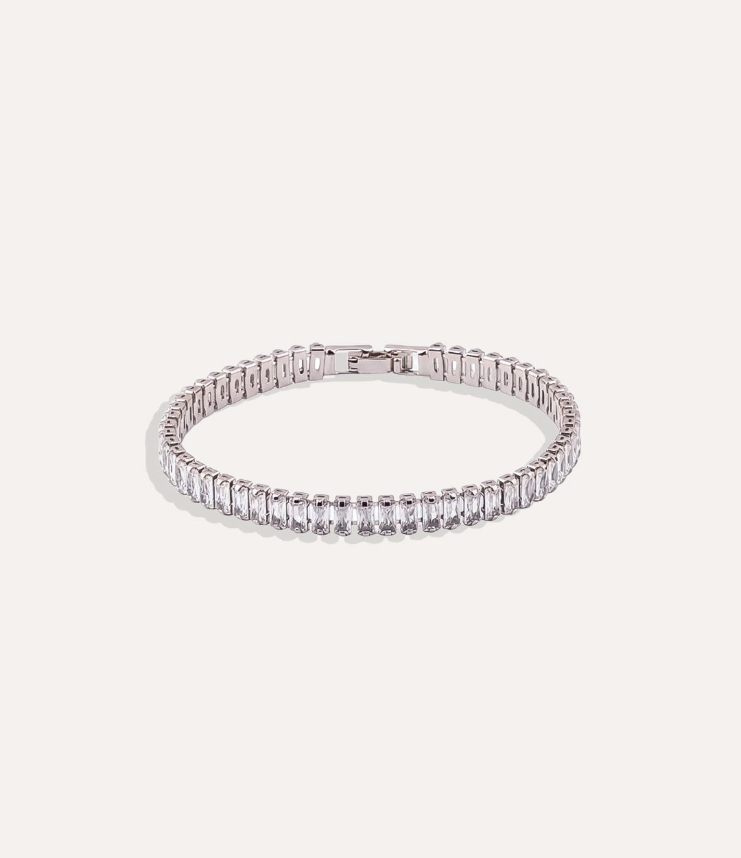Dazzle Tennis Bracelet with silver and white sparkling stones in a sleek design displayed on a neutral background.