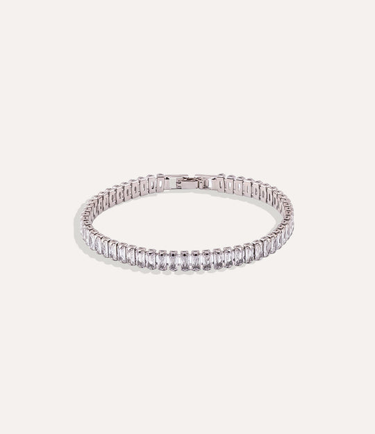 Dazzle Tennis Bracelet with silver and white sparkling stones in a sleek design displayed on a neutral background.