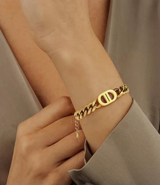 Model wearing the Dhalia Chain Bracelet, showing the elegant D-shaped center detail and gold chain design