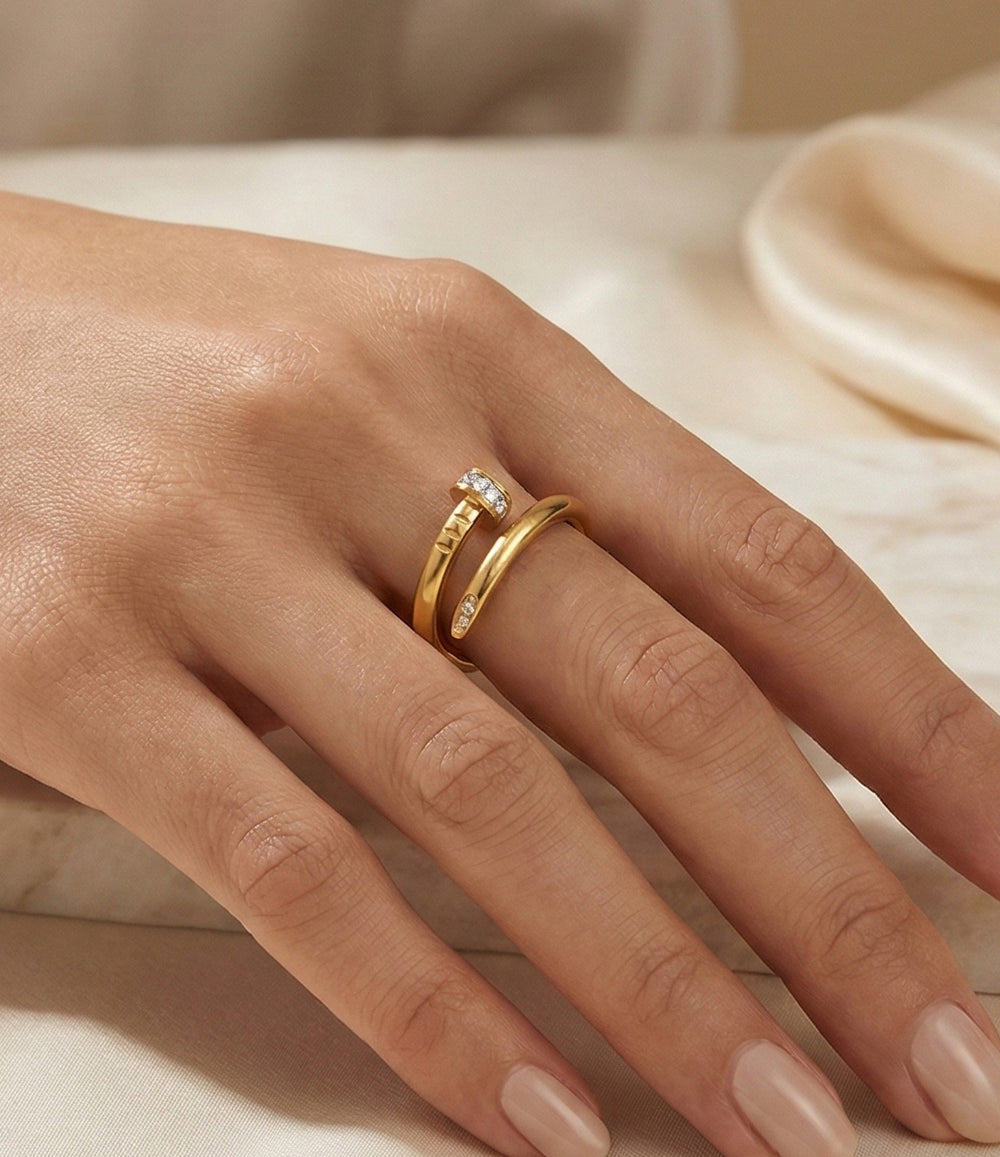 Woman's hand modeling the Diamond Screw Ring on the middle finger, showcasing the luxurious blend of industrial screw details and sparkling diamonds.
