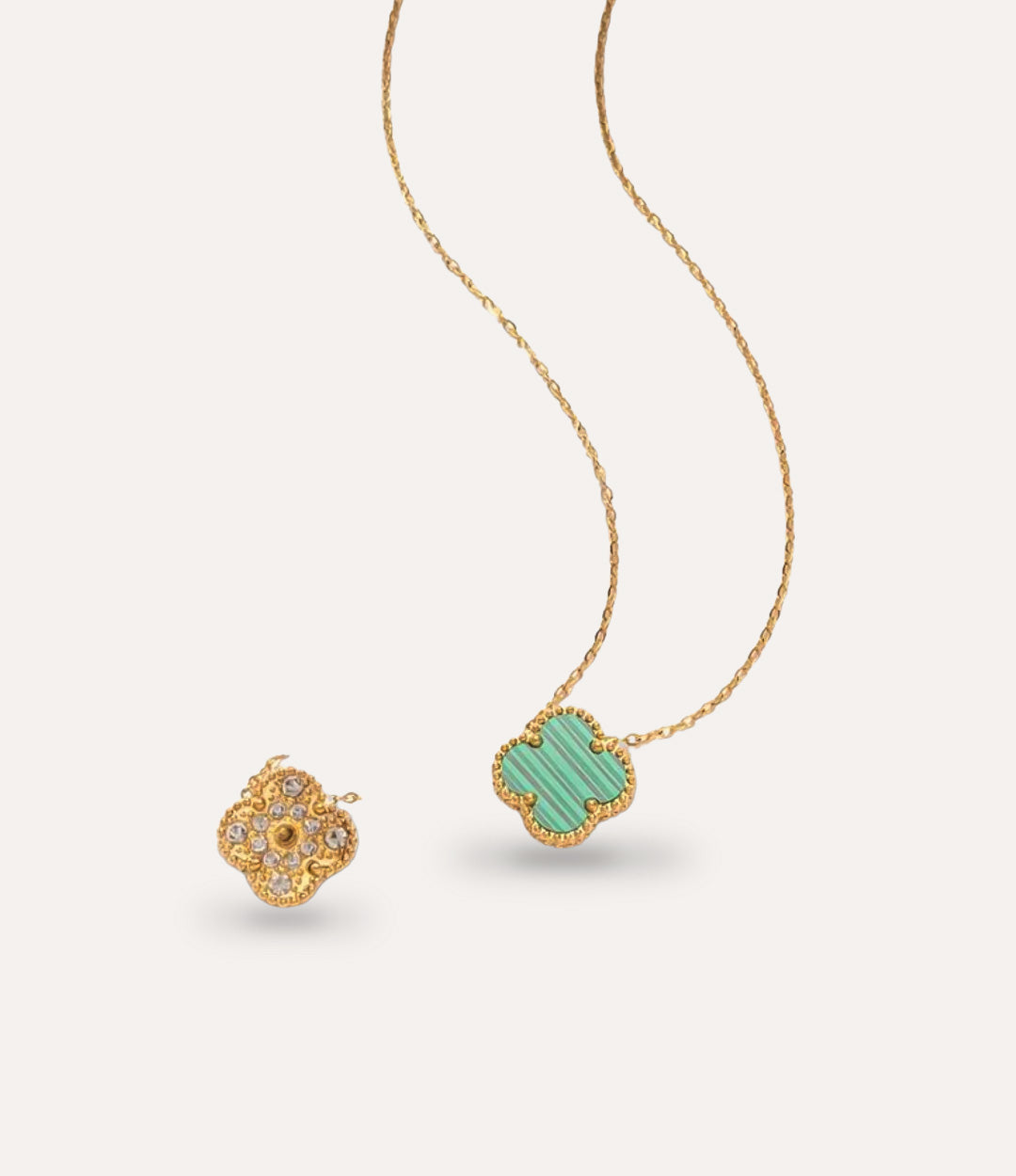 18k gold plated Diamond Clover Necklace with a green pendant.