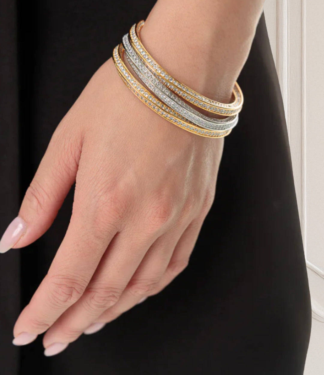 Model wearing the Diamond Cuff in silver and gold, showcasing their elegant and glamorous sparkle