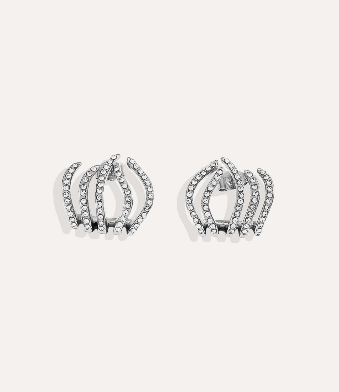 Close up of the Diamond Flame Earring in silver showing the bold flame design and shimmering diamond accents.