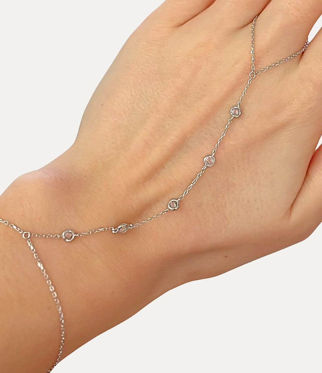 Diamond Circle Hand Chain in silver made of sterling silver with delicate diamond details displayed on a neutral background