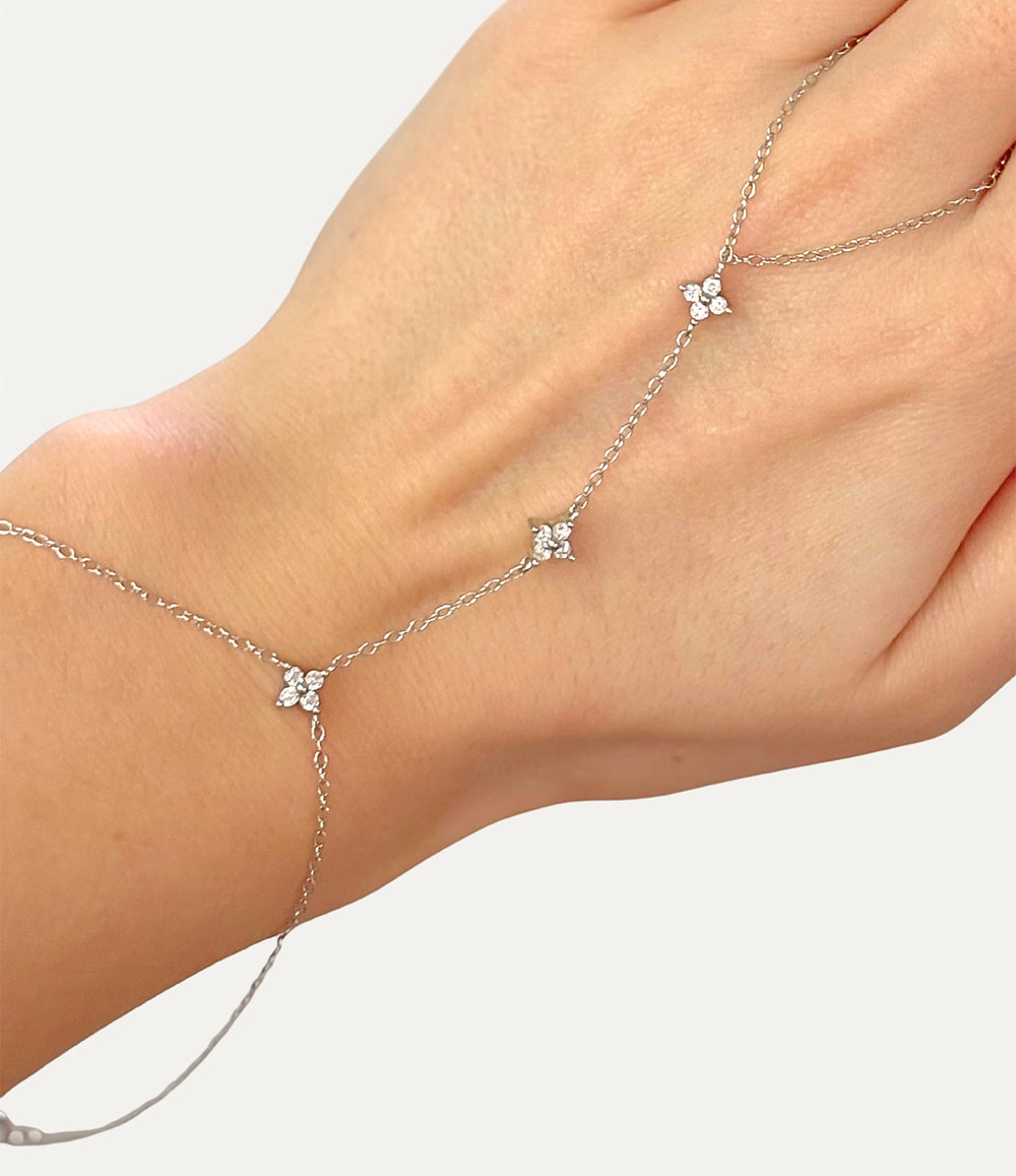 Diamond Star Hand Chain in silver made of sterling silver with delicate diamond details displayed on a neutral background