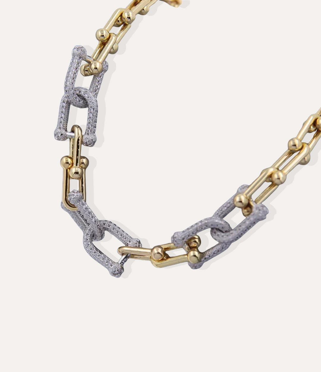 Gold Diamond Horseshoe Link Necklace with shimmering horseshoe connector on a neutral background.