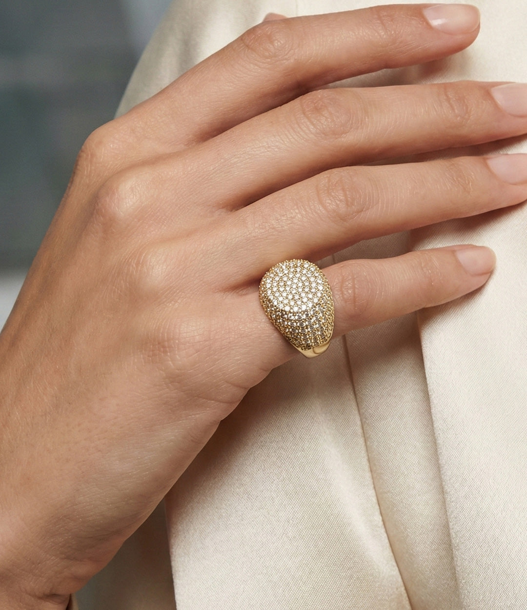 Woman's hand modeling the Diamond Pinky Ring, showcasing the statement size and shimmering diamond details on the pinky finger.