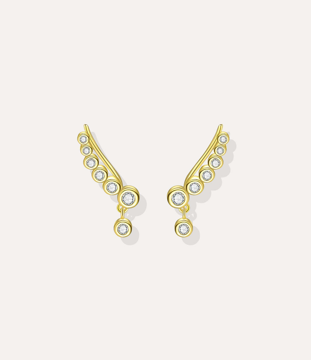 Close up of the Diamond Wing Earrings in gold highlighting the graceful wing design and diamond details.