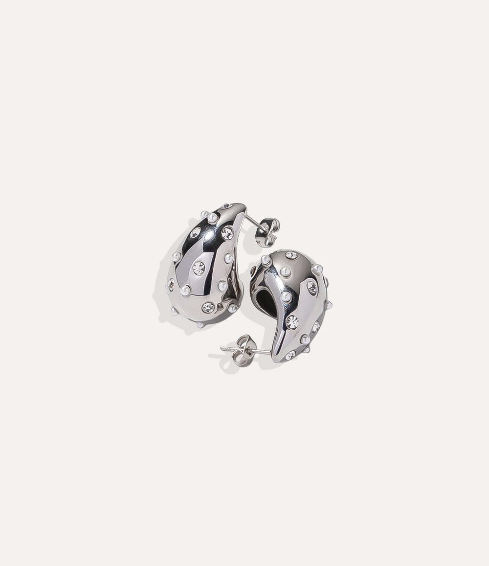 Product shot of the Diamond and Pearl Teardrop Stud in silver colour showing the cool sterling silver tone and sparkling diamond accent on a white background.
