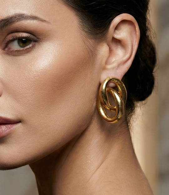 Model wearing the Double Link Earrings, showcasing their oversized intertwined link design and bold statement look.