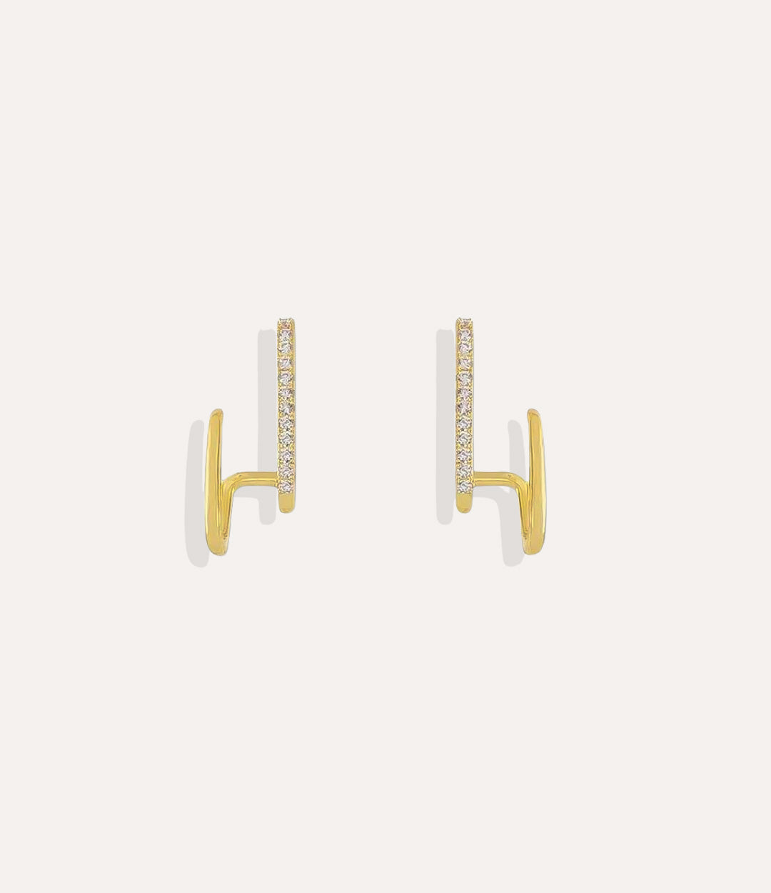 Close up of the Double Diamond Hoop earrings in gold highlighting the double-hoop effect and diamond detailing