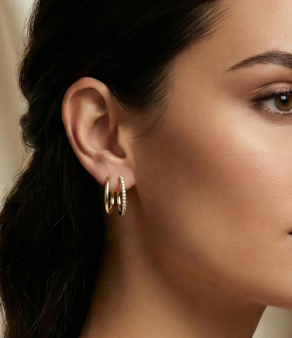 Model wearing the Double Diamond Hoop earrings showcasing the dainty double-hoop design and sparkling diamond accents