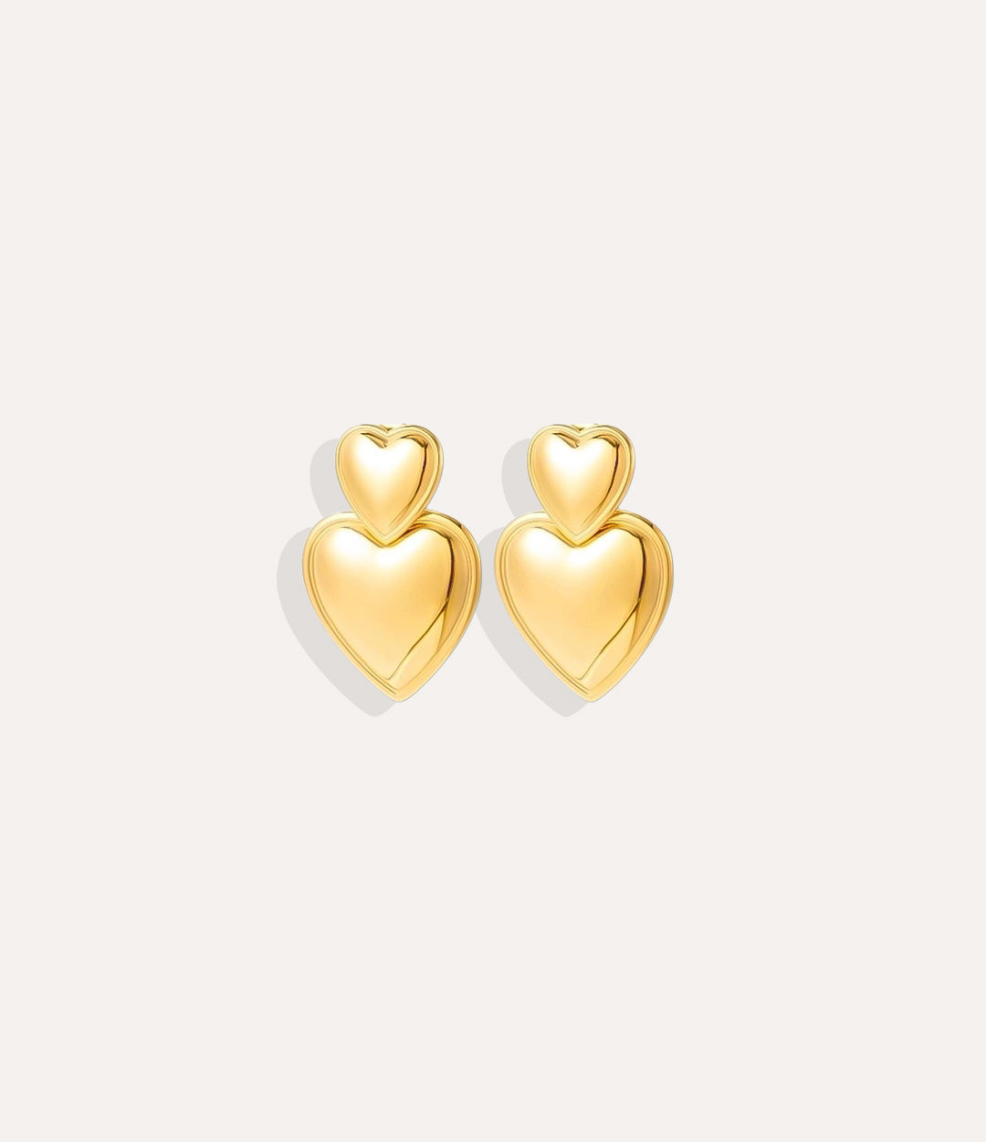 Product shot of the Double Heart Earrings in 18k gold plating displaying the two connected hearts and high shine finish on a white background.