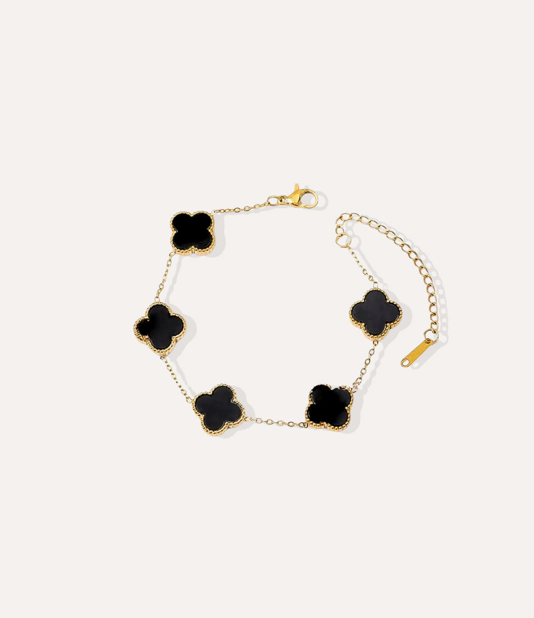 Double Sided Clover Bracelet in gold plated finish with dual-sided black clover charm, displayed in a close-up product shot.