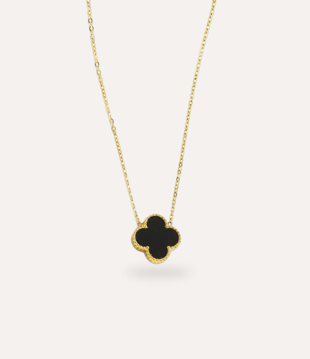 Double Sided Black Clover Necklace in gold plating displayed on a clean neutral background