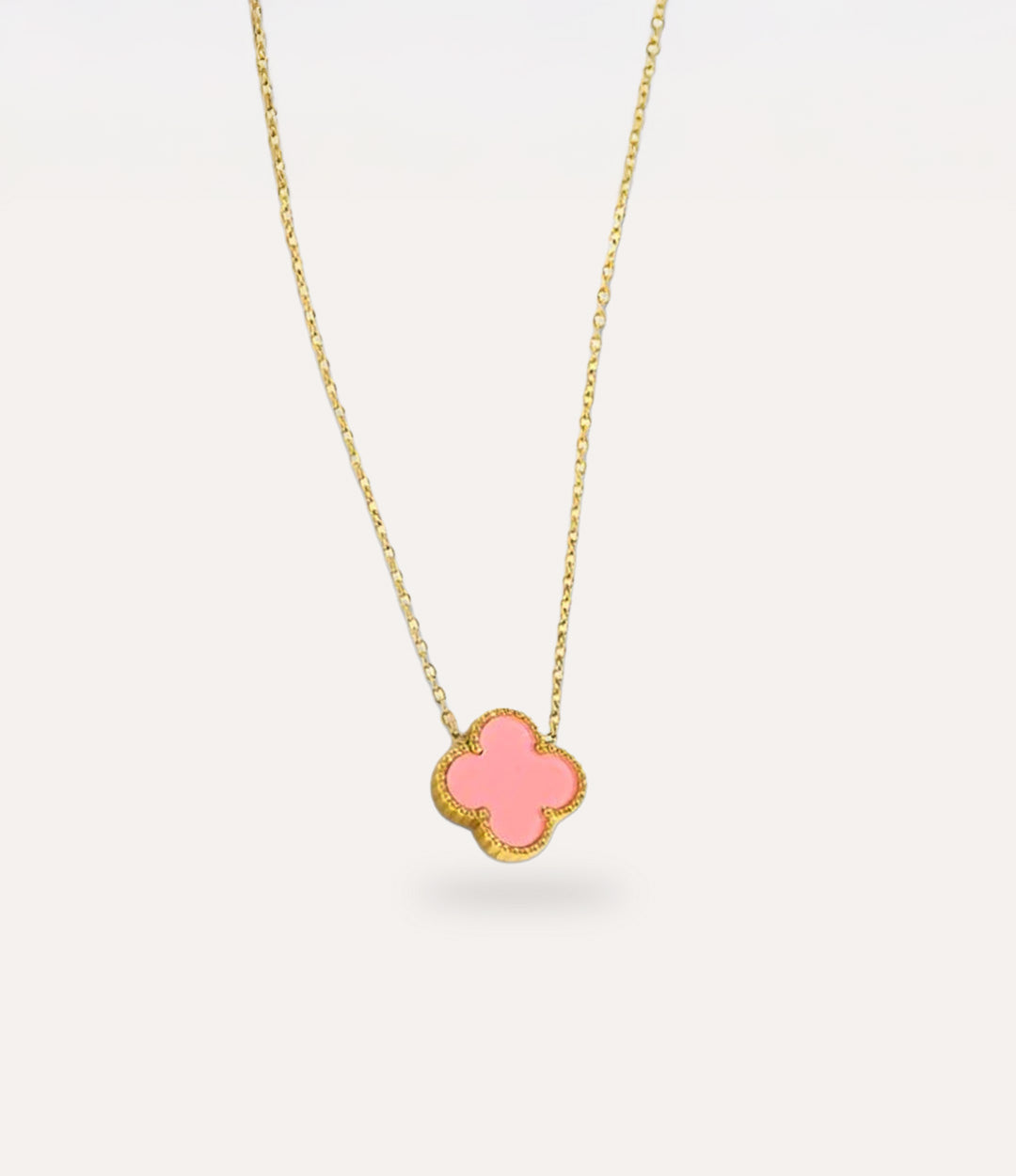 Double Sided Pink Clover Necklace in gold plating displayed on a clean neutral background