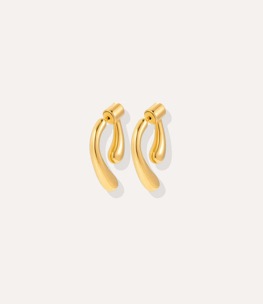 Close up of the Double Sided Drop Earrings in gold, highlighting the polished 18k gold plating and chic wrap design.