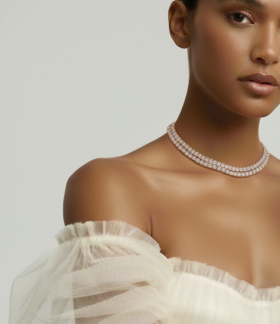 Woman wearing a double tennis necklace with diamonds in rose gold