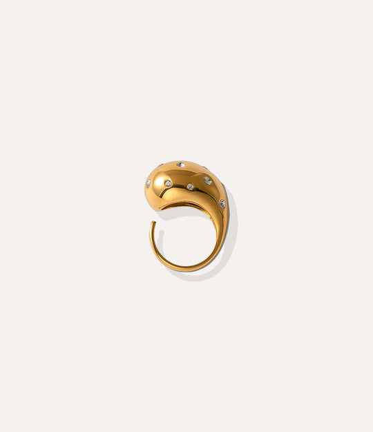 Drop Ring in 14k gold plated finish, featuring an adjustable band adorned with crystal stones, isolated on a white background.
