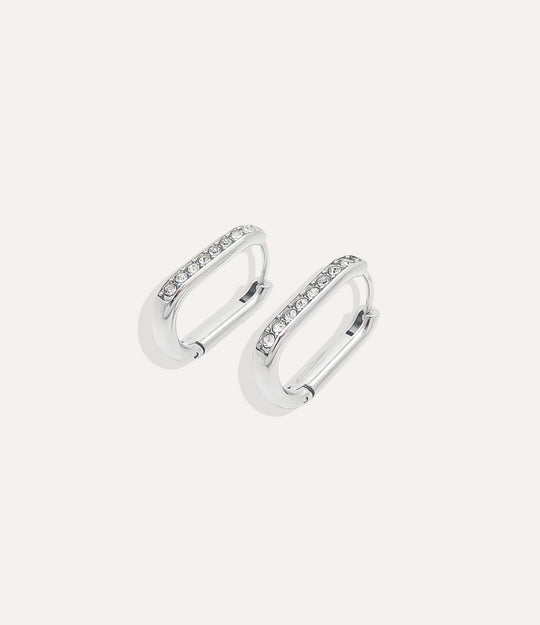 Pair of silver hoop earrings with small stones on a white background