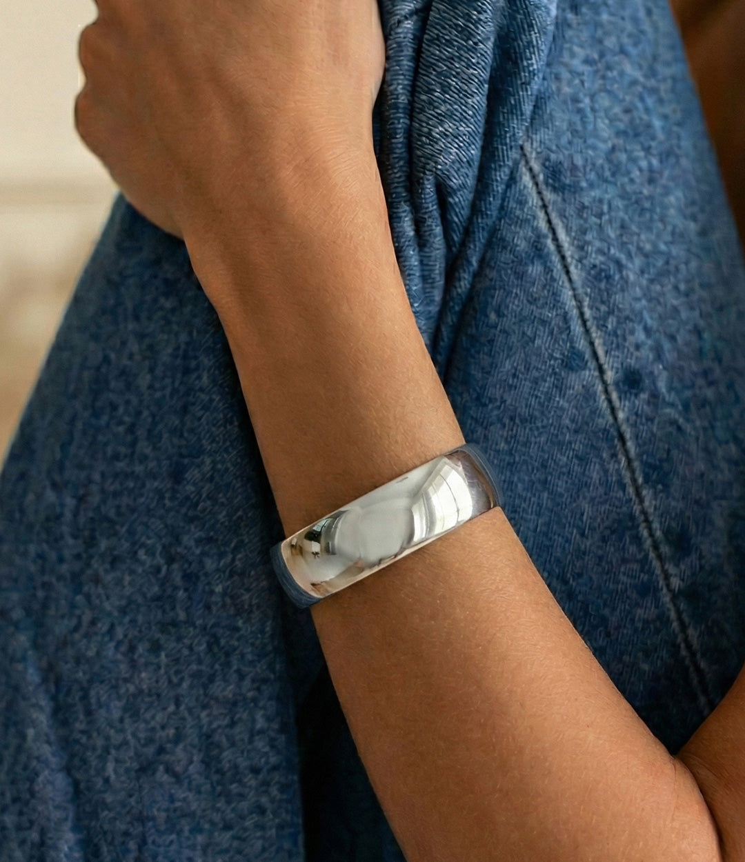 Model wearing Essential Bangle in silver
