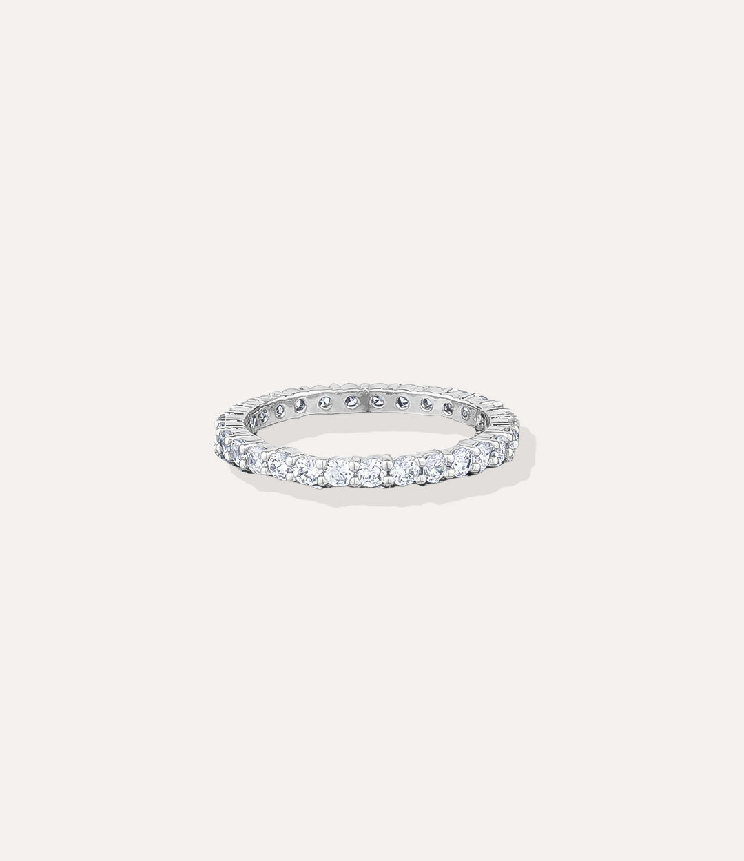 Silver Eternity Band, highlighting the cool silver tone and the brilliance of the diamond stones in a classic eternity setting.