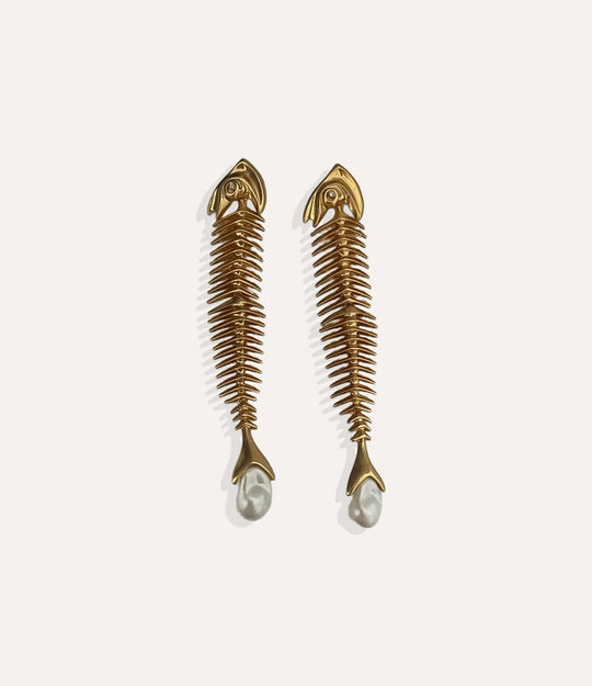 Close up of Fishbone Dangly Earrings in gold highlighting the fish skeleton motif and polished finish.