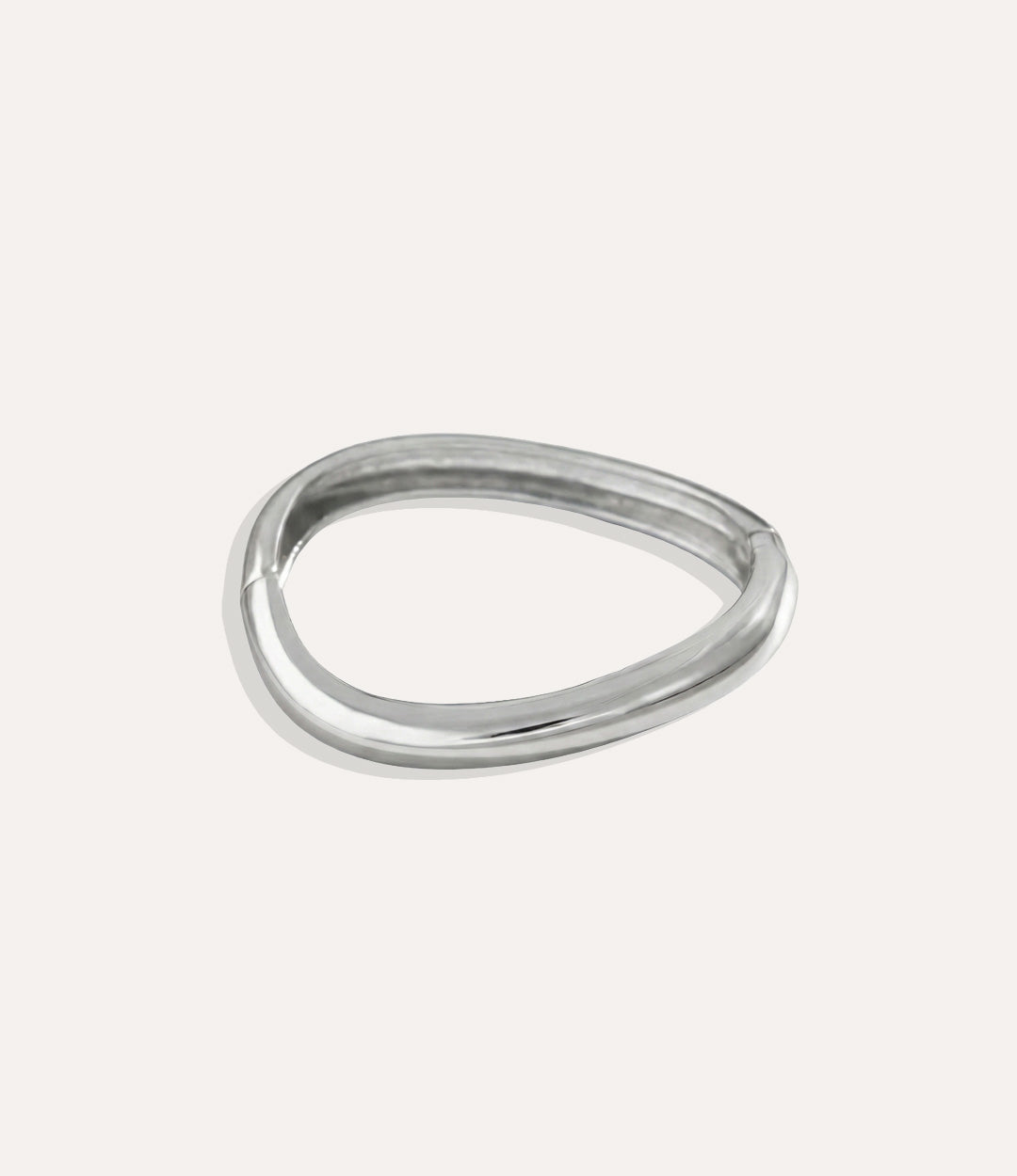 Silver Fluid Bangles with modern free-form design displayed on a clean background